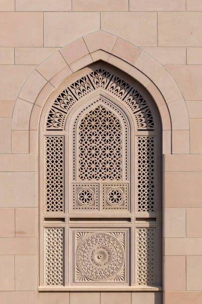 Carved sandstone jaali screen set into an arched façade